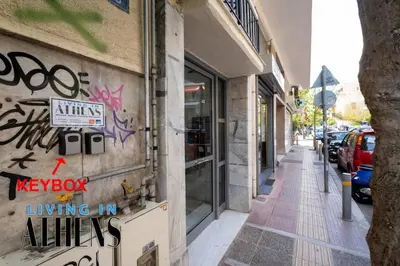 a street with graffiti on the side of a building at Spacious Familly Apt Next To Acropolis And Museum 4&1 in Athens