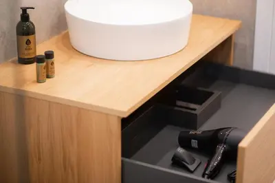 a wooden counter with a sink and a bottle of wine at Megaro Luxury Suite 11 in Syntagma in Athens