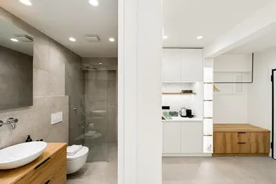 a bathroom with a sink and a toilet and a shower at Megaro Luxury Suite 7 in Syntagma in Athens