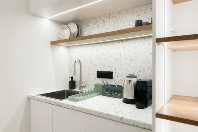 a kitchen with a sink and a counter top at Megaro Luxury Suite 7 in Syntagma in Athens