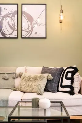 a living room with a couch and a glass table at Beautiful Apartment in the most Iconic area in Athens in Athens
