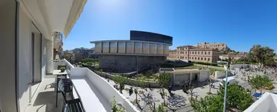 a view of a building from the balcony of a building at Acropolis Panorama Suite by YHA in Athens