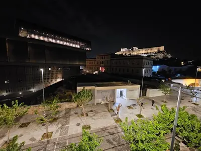 a view of a city at night at Acropolis Panorama Suite by YHA in Athens