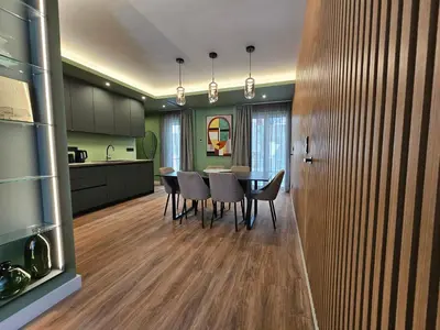 a kitchen and dining room with a table and chairs at Acropolis Panorama Suite by YHA in Athens