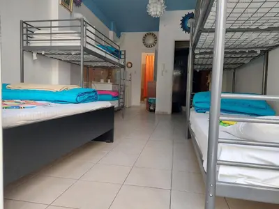 a room with two bunk beds and a hallway at Acropolis views in Monastiraki square in Athens