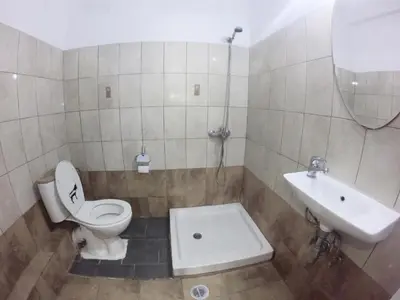 a bathroom with a toilet and a sink at Acropolis views in Monastiraki square in Athens