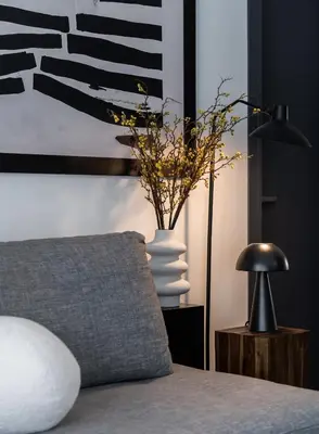 a bedroom with a bed with a pillow and a lamp at ATELIER 64 , Monastiraki Apartments & Suites in Athens