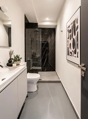 a bathroom with a toilet and a sink at ATELIER 64 , Monastiraki Apartments & Suites in Athens