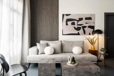 a living room with a couch and a table at ATELIER 64 , Monastiraki Apartments & Suites in Athens