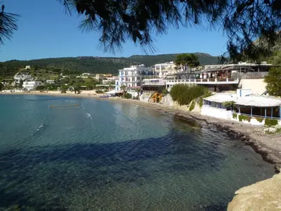 a view of a beach with white buildings at Liberty II in Agia Marina Aegina