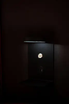 a close up of a black box in a dark room at One-Bedroom Jacuzzi Glyfada in Athens