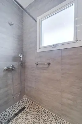 a shower with a window in a bathroom at 2bedroom Apartment in Glyfada in Athens