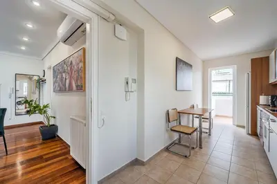a kitchen and living room with a table and chairs at 2bedroom Apartment in Glyfada in Athens