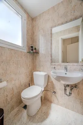 a bathroom with a toilet and a sink at 2bedroom Apartment in Glyfada in Athens