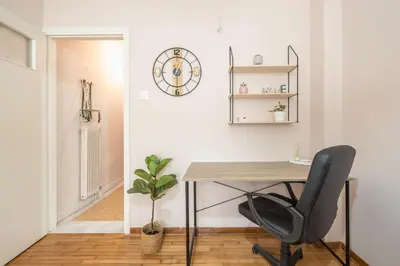 a home office with a desk and a chair at Ble Elia Karyatis Suite in Athens