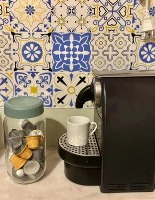a coffee maker with a mug and a coffee cup at Athens Harmony in Athens