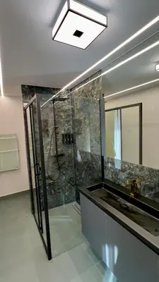 a bathroom with a shower with a glass wall at CasaMare Lagonisi Athens Riviera Luxury modern villas apartment's in Lagonissi