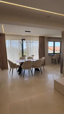 a dining room with a table and chairs at CasaMare Lagonisi Athens Riviera Luxury modern villas apartment's in Lagonissi