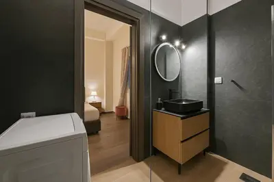 a bathroom with a sink and a mirror at The Urban Sanctuary in the heart of Sepolia, Athens in Athens