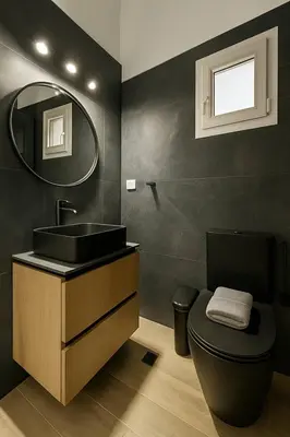 a bathroom with a sink and a toilet and a mirror at The Urban Sanctuary in the heart of Sepolia, Athens in Athens