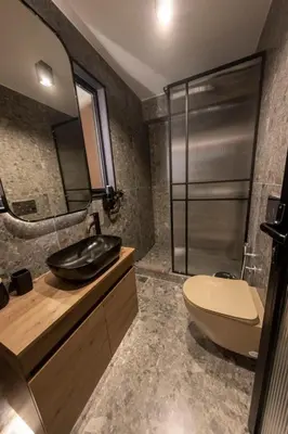 a bathroom with a sink and a toilet and a shower at Acropolis View 302 By Pantheon Ermou in Athens