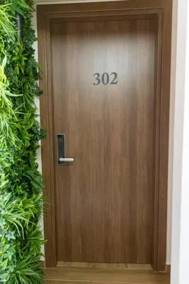 a wooden door with the number on it at Acropolis View 302 By Pantheon Ermou in Athens