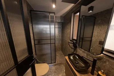 a bathroom with a shower and a toilet and a sink at Acropolis View 302 By Pantheon Ermou in Athens