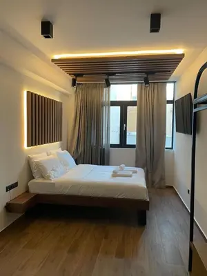 a bedroom with a large bed in a room at Acropolis View 302 By Pantheon Ermou in Athens