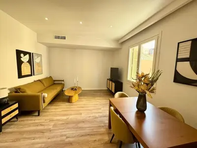 a living room with a couch and a table at Plaka Two-Bedroom Flat with Acropolis View Terrace in Athens