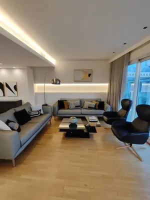 a living room with two couches and a table at Monastiraki 2 Bedroom Acropolis View with Terrace in Athens