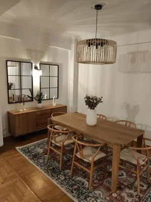 a dining room with a wooden table and chairs at Pangrati Varnava -2 Bedroom Flat in Athens