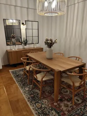 a dining room with a wooden table and chairs at Pangrati Varnava -2 Bedroom Flat in Athens