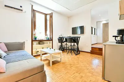 a living room with a couch and a table at Modern Flat in Central Athens - Lavatera in Athens