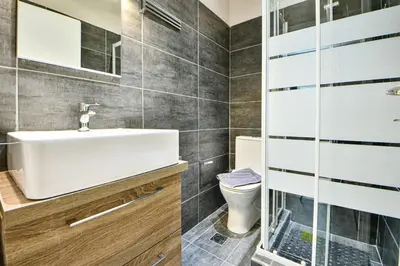 a bathroom with a sink and a toilet at Modern Flat in Central Athens - Lavatera in Athens