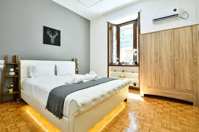 a bedroom with a bed and a window at Cozy Flat in Central Athens - Iris in Athens