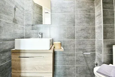 a bathroom with a sink and a toilet at Cozy Flat in Central Athens - Papaver in Athens