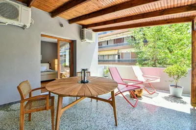 a patio with a table and chairs on a balcony at City Center Flat with Terrace (Capparis) in Athens