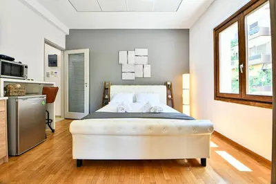 a bedroom with a large white bed in a room at City Center Flat with Terrace (Capparis) in Athens