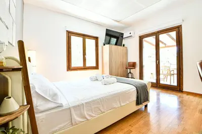 a bedroom with a bed with two towels on it at City Center Flat with Terrace (Capparis) in Athens