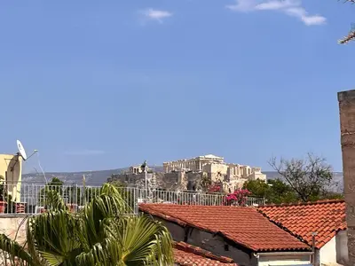 a view of the acropolis from the roofs of houses at Thiseio Villa Acropolis View in Athens