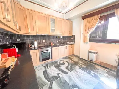 a kitchen with a floor in the middle of it at Thiseio Villa Acropolis View in Athens
