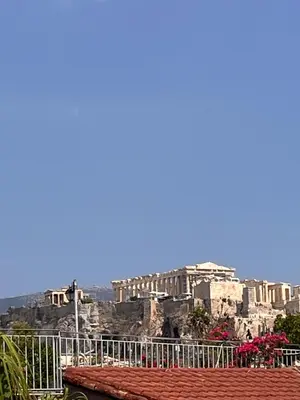 a view of the acropolis from the roof of a building at Thiseio Villa Acropolis View in Athens
