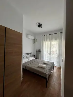 a bedroom with a bed and a large window at The Central Athens Thission in Athens