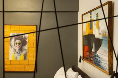 a room with a picture of a woman wearing sunglasses at Urban Art Suites in Athens