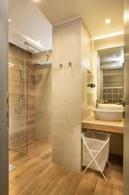 a bathroom with a sink and a shower at Urban Art Suites in Athens