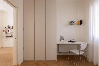 a white room with a desk and a chair at Athenian Vintage Apartment in Athens