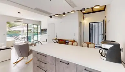 a kitchen with a white counter and a mirror at Κ2 Varkiza Seaside Residences in Vari