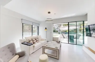 a living room with a couch and a table at Κ2 Varkiza Seaside Residences in Vari