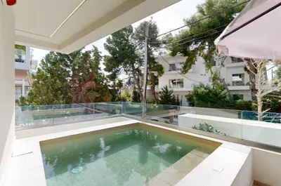 a swimming pool on the roof of a house at Κ2 Varkiza Seaside Residences in Vari