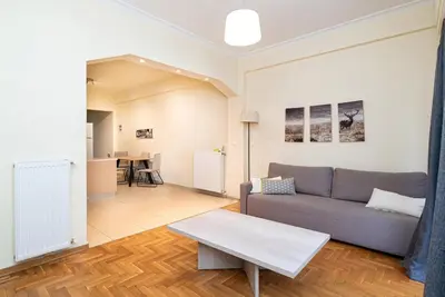 a living room with a couch and a table at Casa Del Guerriero, Athens in Athens
